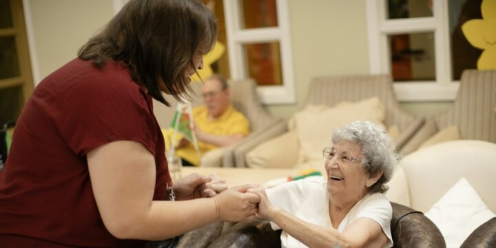 Caregiver assisting an elderly woman with her walker, a moment of respectful support