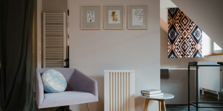 Electric heater in a room with a chair and table, an alternative to traditional radiators